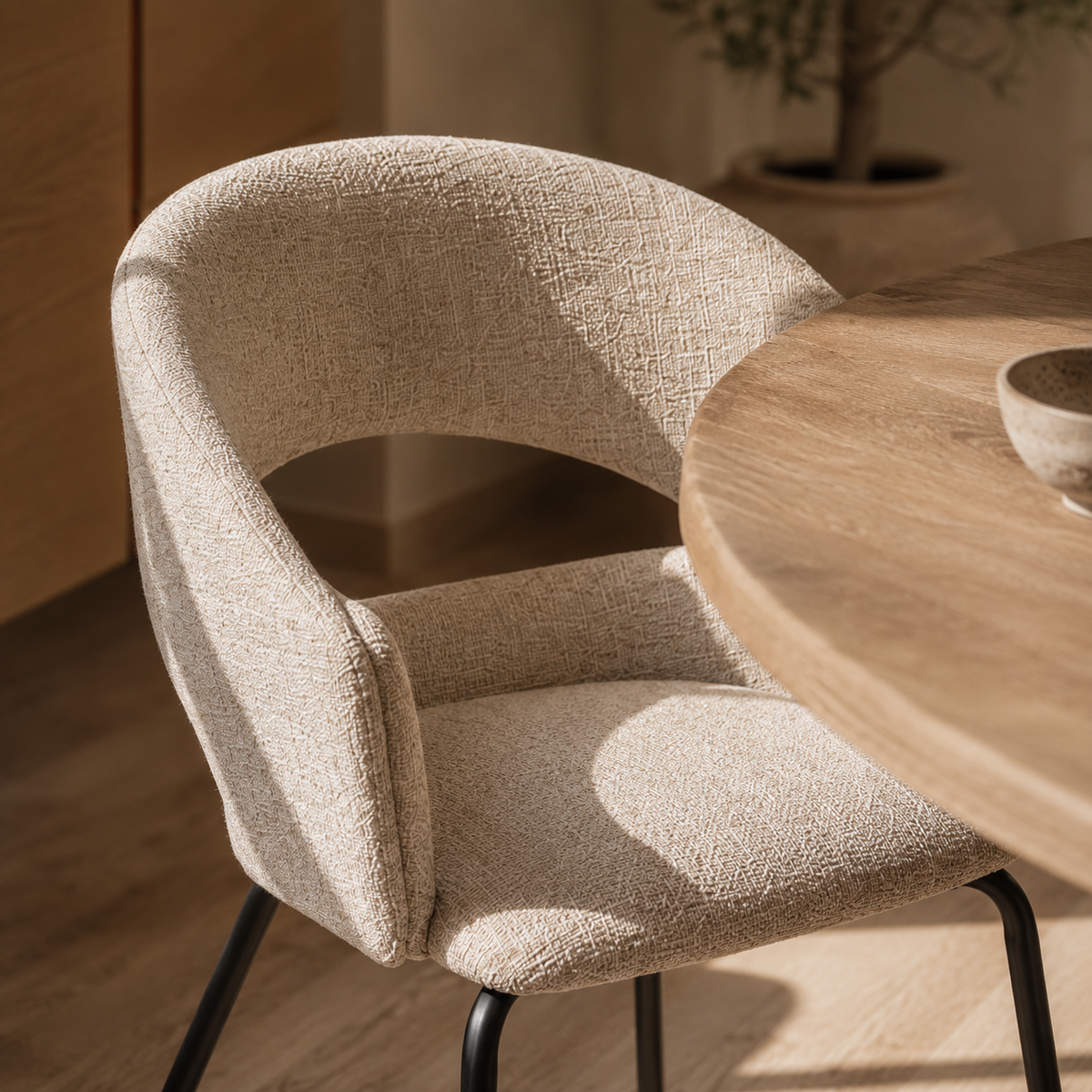 Upholstered dining chair with armrests, metal legs