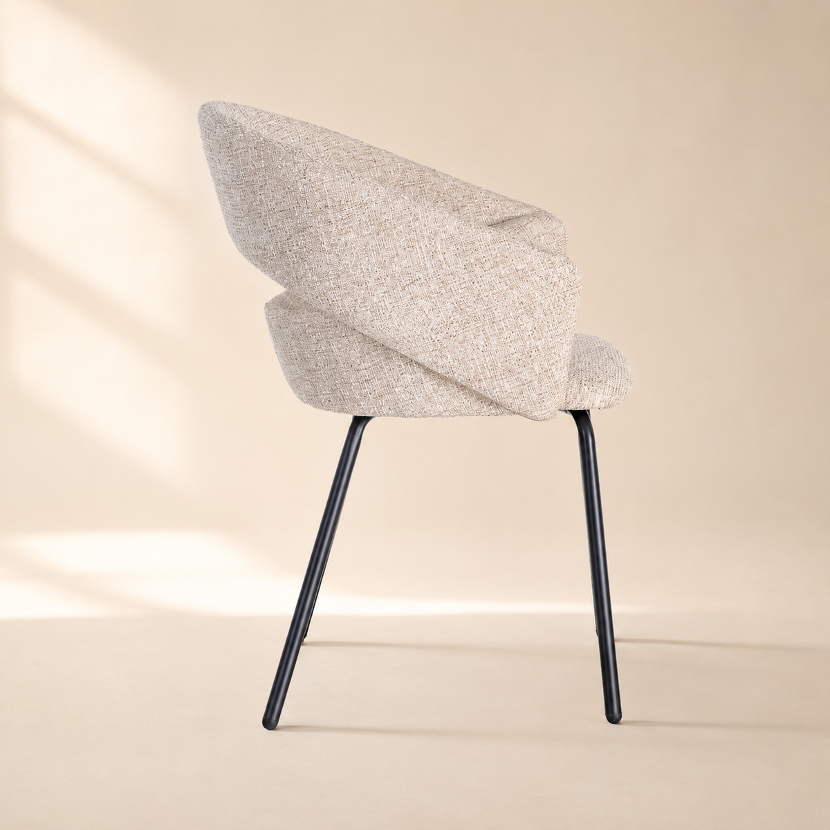 Upholstered dining chair with armrests, metal legs