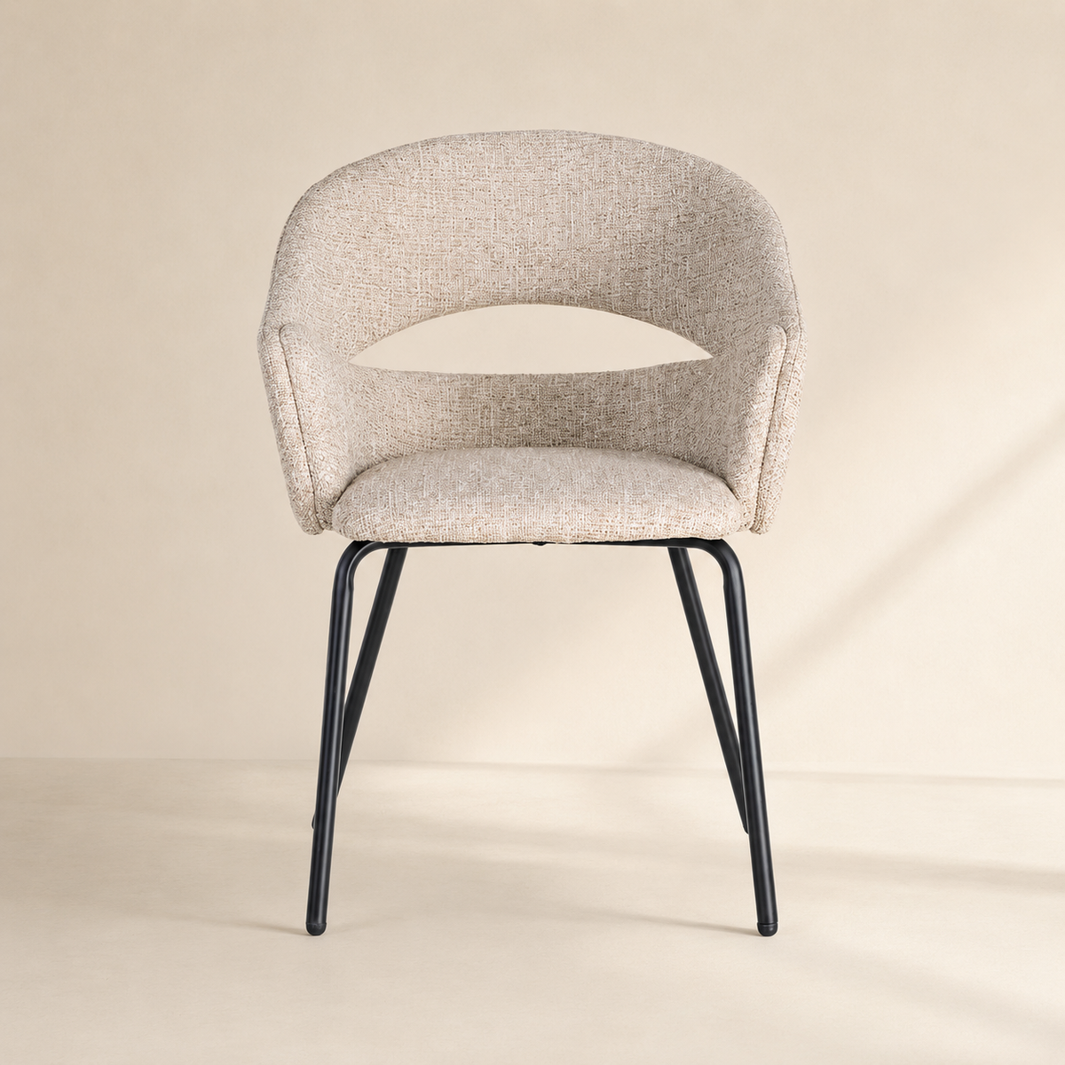 Upholstered dining chair with armrests, metal legs