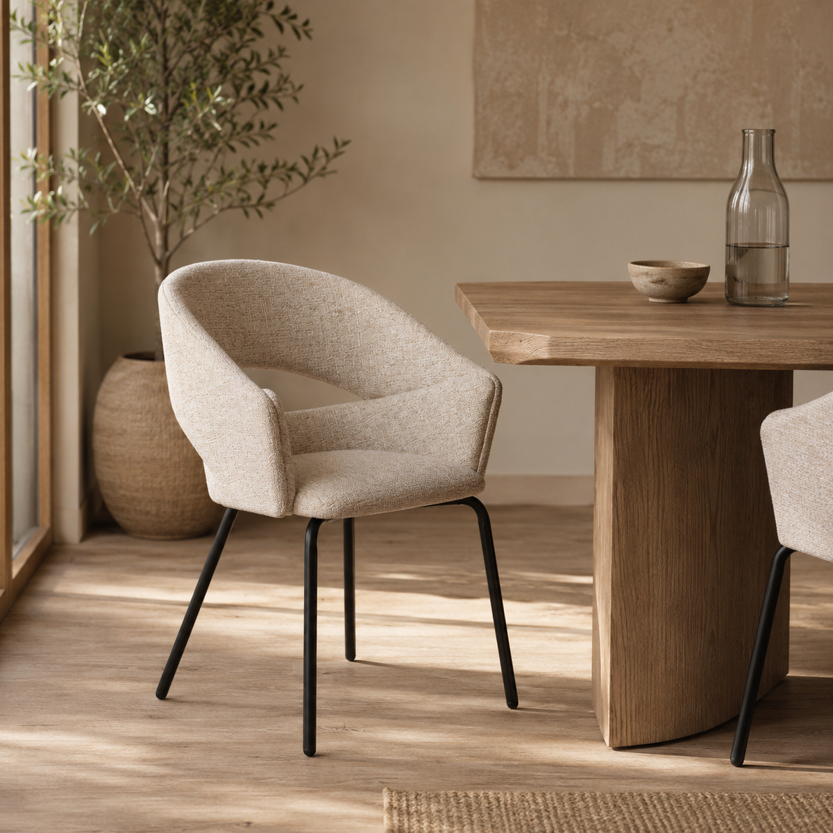 Upholstered dining chair with armrests, metal legs