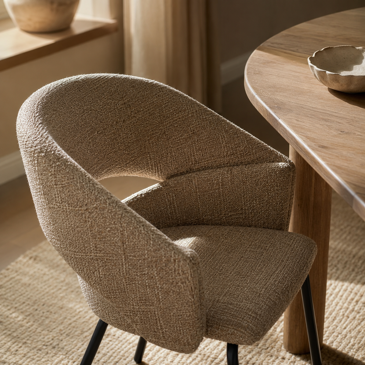 Upholstered dining chair with armrests, metal legs
