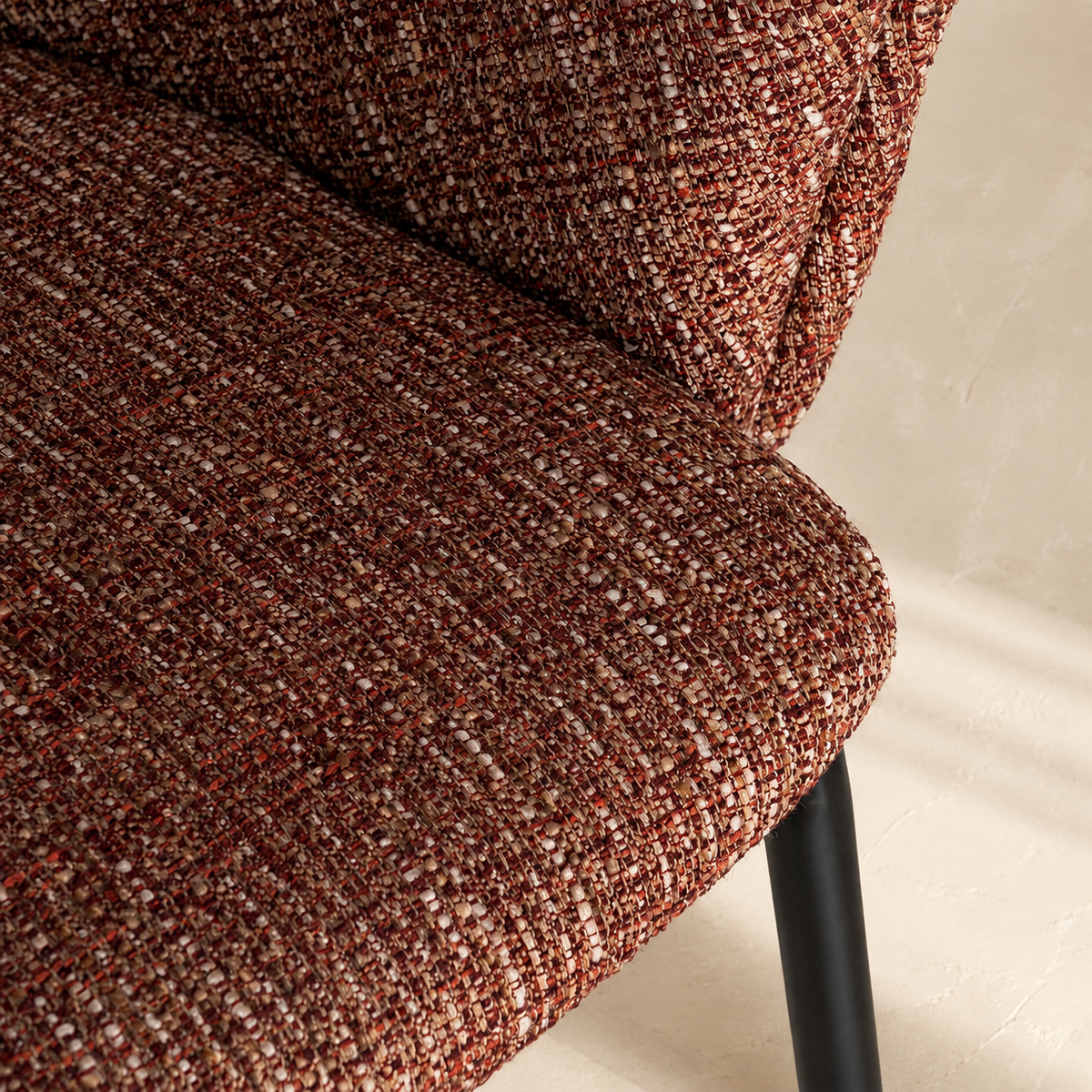 Upholstered dining chair with armrests, metal legs